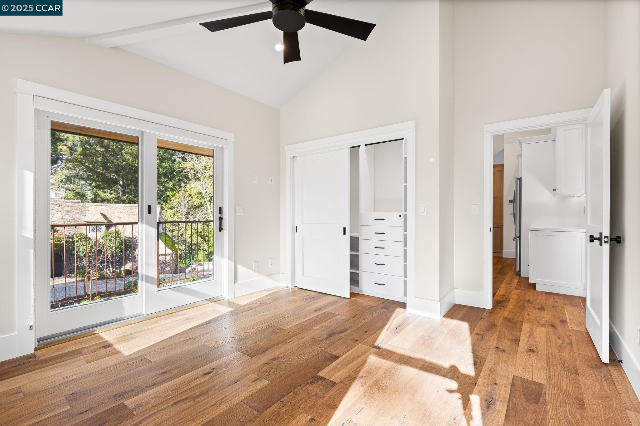 100 B Moraga Way Orinda, CA 94563 - Photo 38 of 48 a view of a bedroom with wooden floor and a bed
