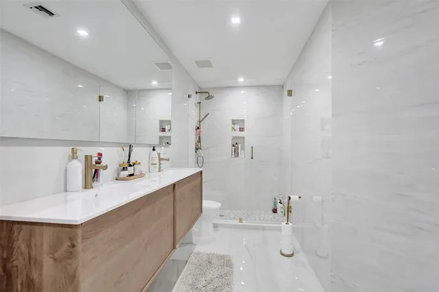 a large white kitchen with a lot of counter space