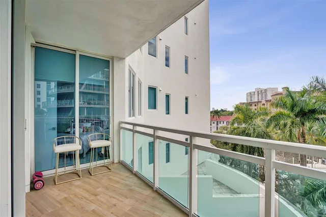 a view of balcony with furniture