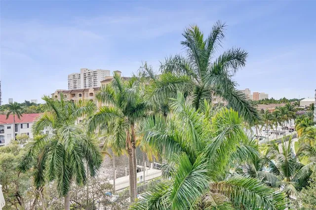 a view of a backyard with swimming pool