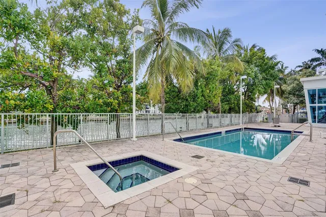 a view of a swimming pool with a patio