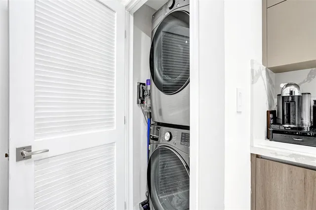 a view of a kitchen with washer and dryer