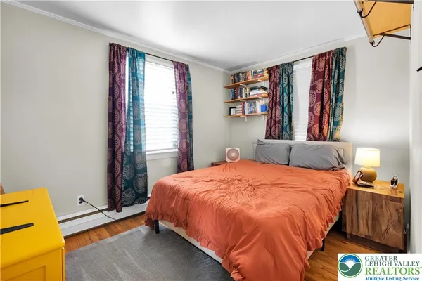 a bedroom with a bed and a book shelf