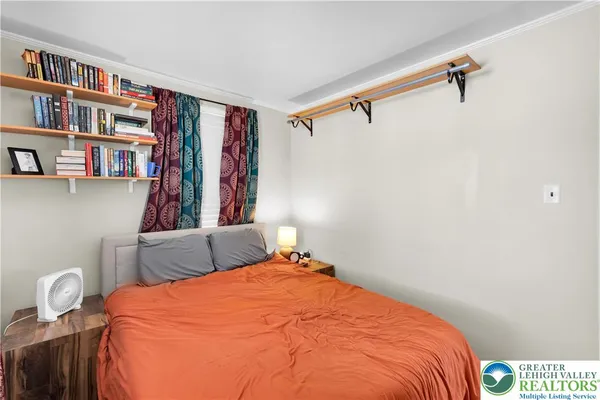 a bed room with a bed and a book shelf