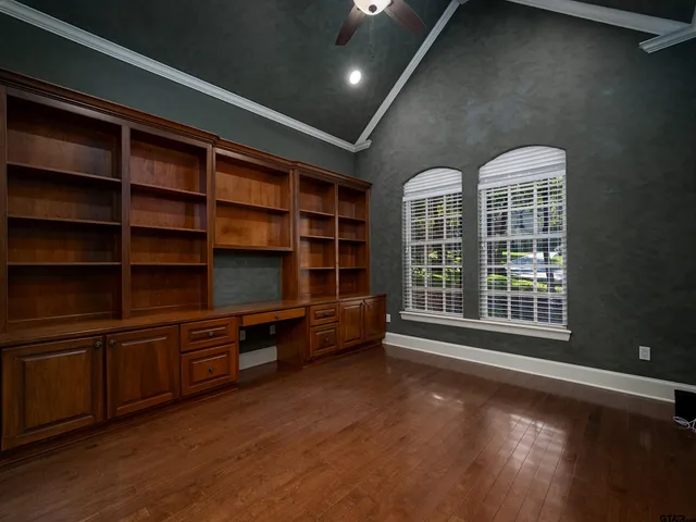 a room with furniture and a book shelf