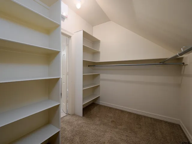 a view of an empty walk in closet
