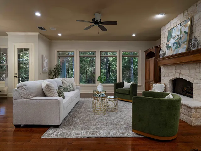 a living room with furniture and a fireplace