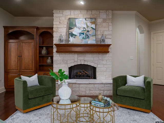 a living room with furniture and a fireplace