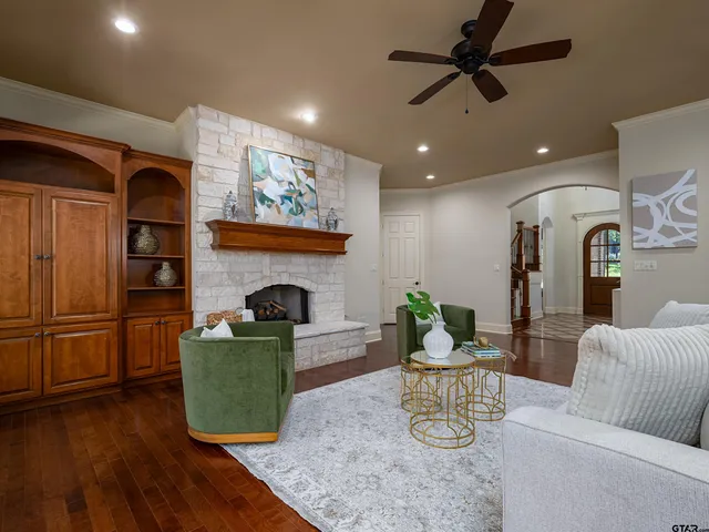 a living room with furniture and a fireplace