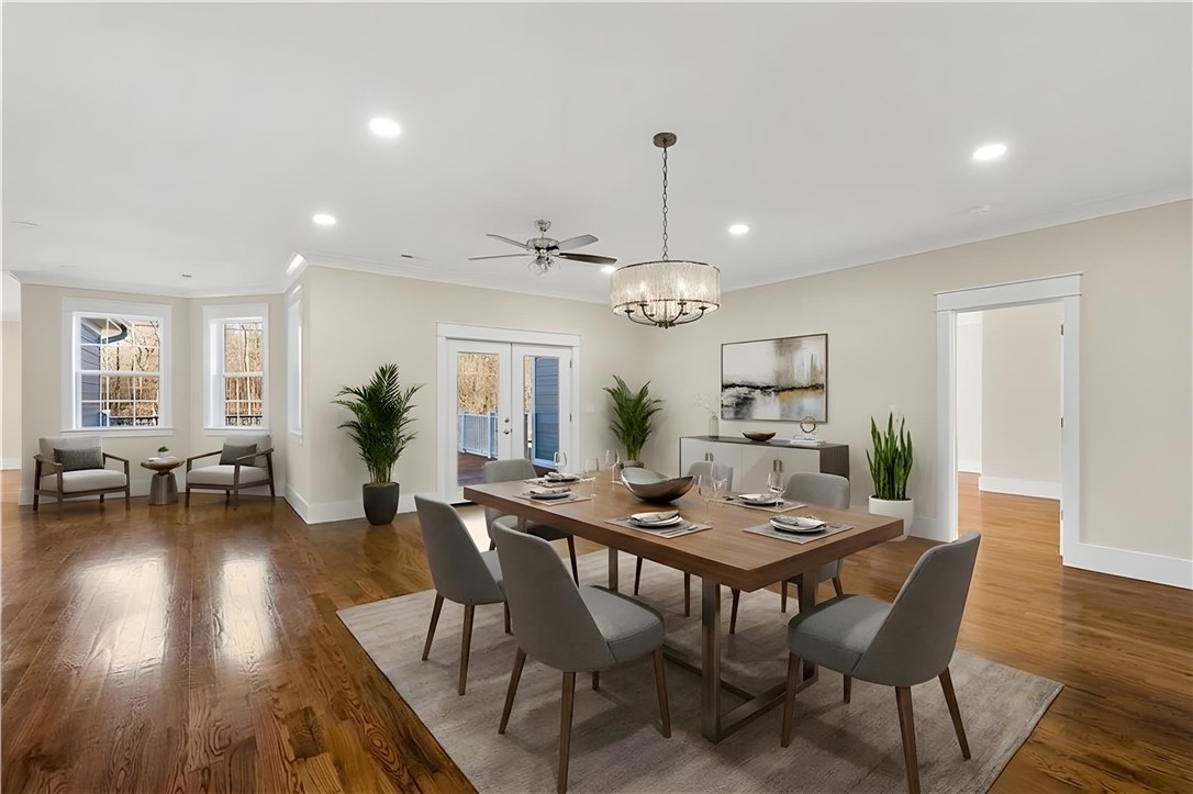 303 Regency Circle Anderson, SC 29625 - Photo 4 of 50 This bright dining room features rich hardwood flooring and outdoor access.
