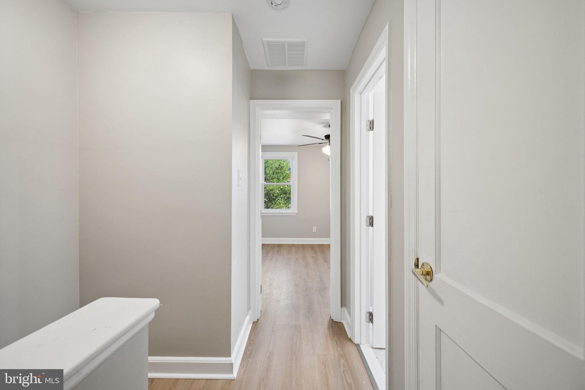 3548 Benzinger Road Baltimore, MD 21229 - Photo 25 of 40 a view of a bathroom from a hallway