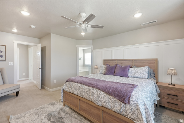 3244 West 1670th Street North Provo, UT 84601 - Photo 26 of 56 Spacious bedroom featuring light-toned carpet flooring, a wood-finish bed frame, and board and batten accent wall