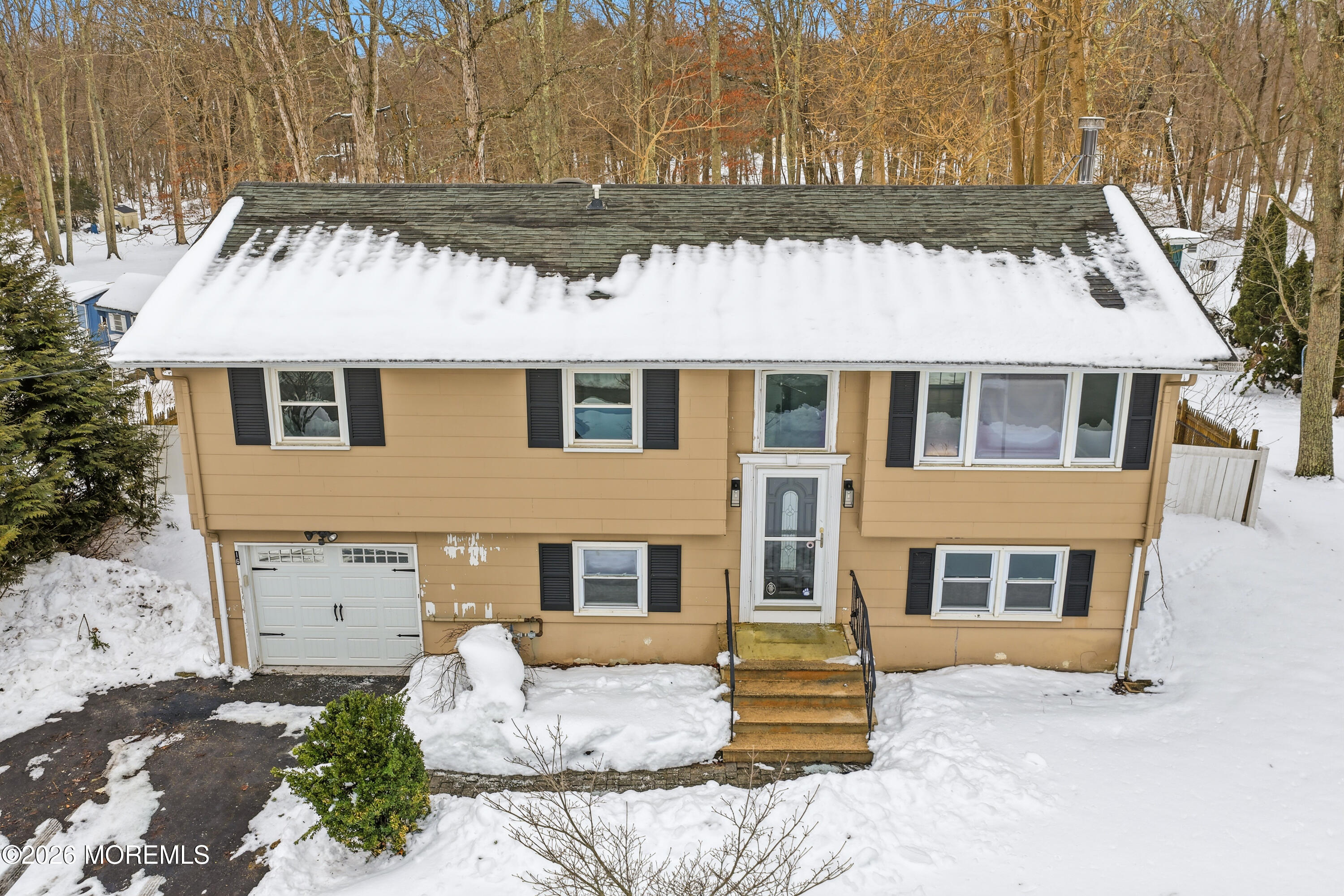 16 Crest Road Jackson, NJ 08527 - Photo 11 of 56 a front view of a house with a tree