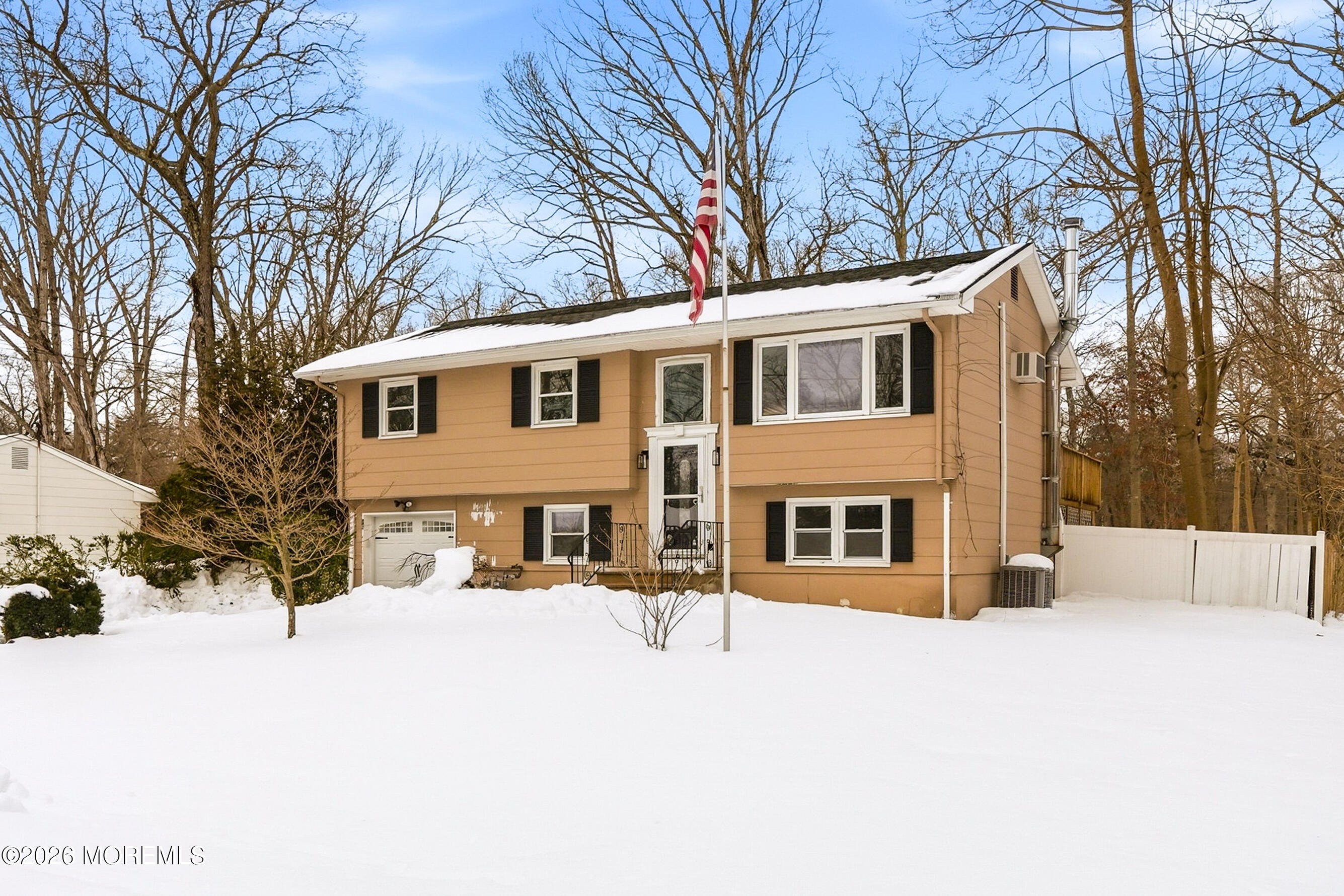 16 Crest Road Jackson, NJ 08527 - Photo 17 of 56 a view of a house with a yard covered in snow