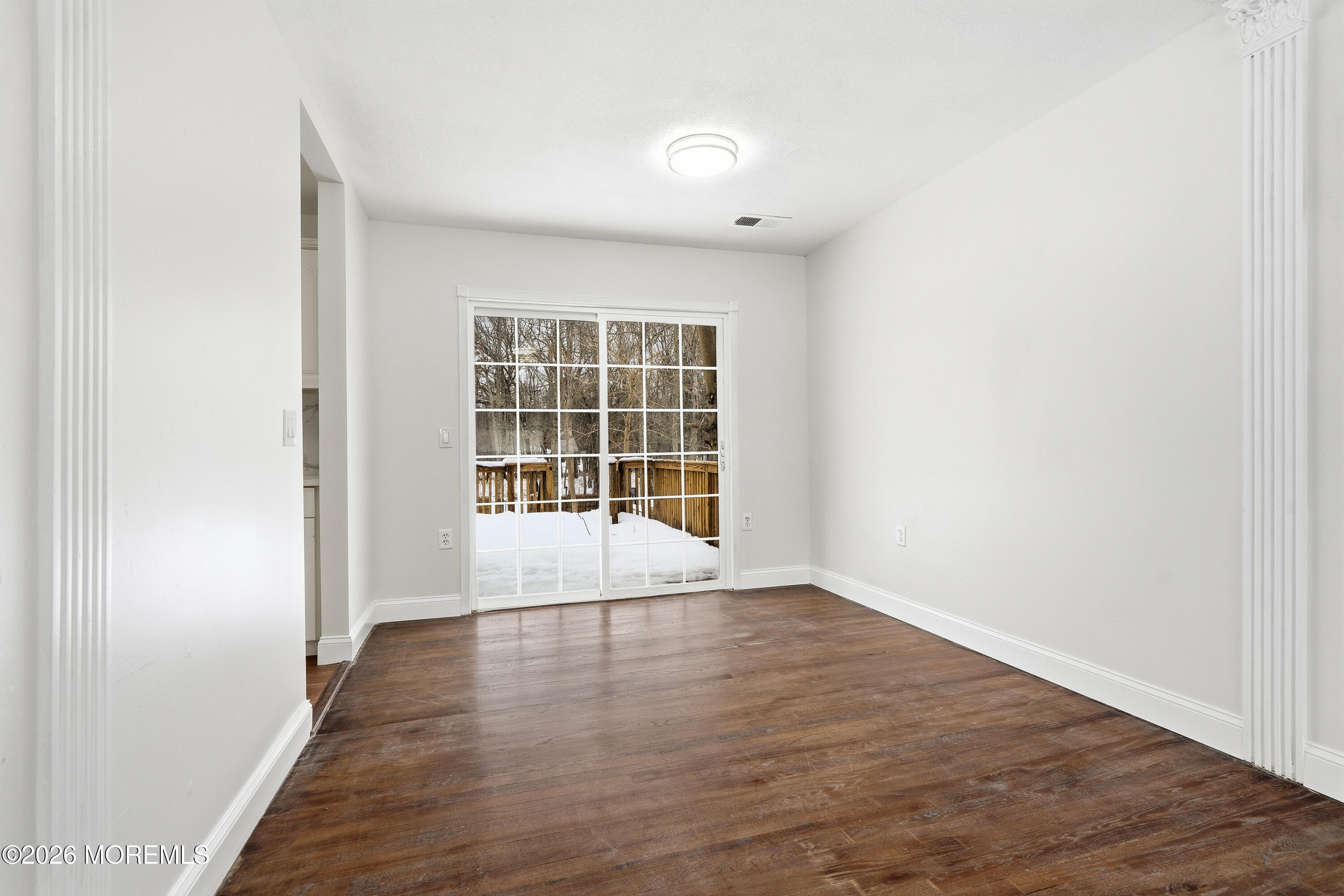 16 Crest Road Jackson, NJ 08527 - Photo 23 of 56 an empty room with wooden floor and windows