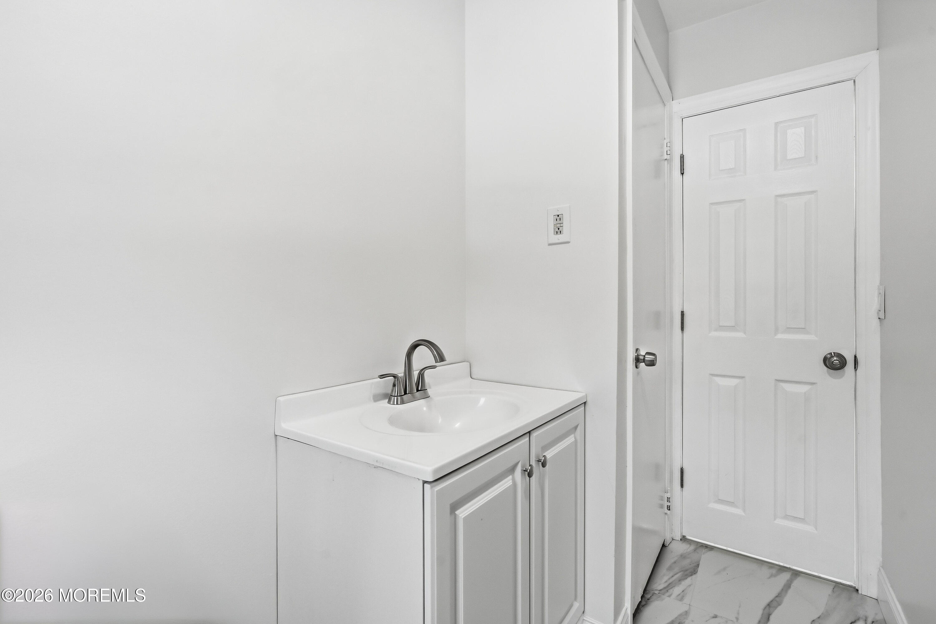 16 Crest Road Jackson, NJ 08527 - Photo 30 of 56 a bathroom with a sink and mirror