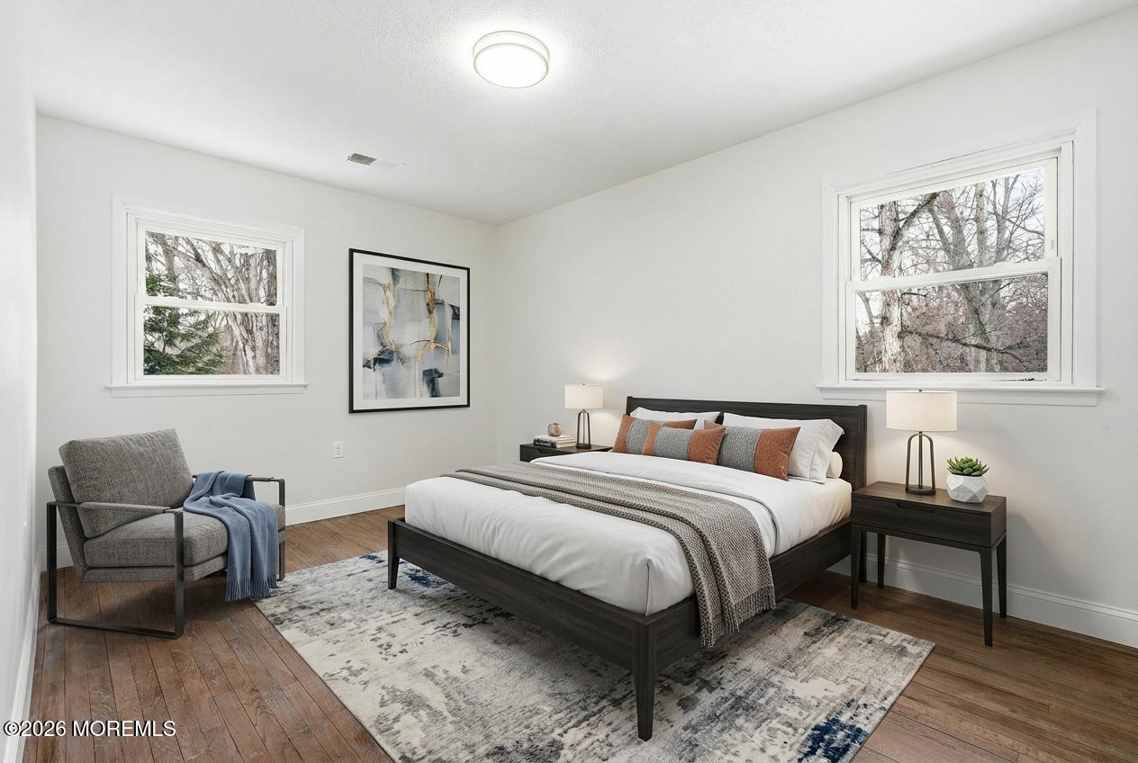 16 Crest Road Jackson, NJ 08527 - Photo 32 of 56 a bedroom with a bed and a couch