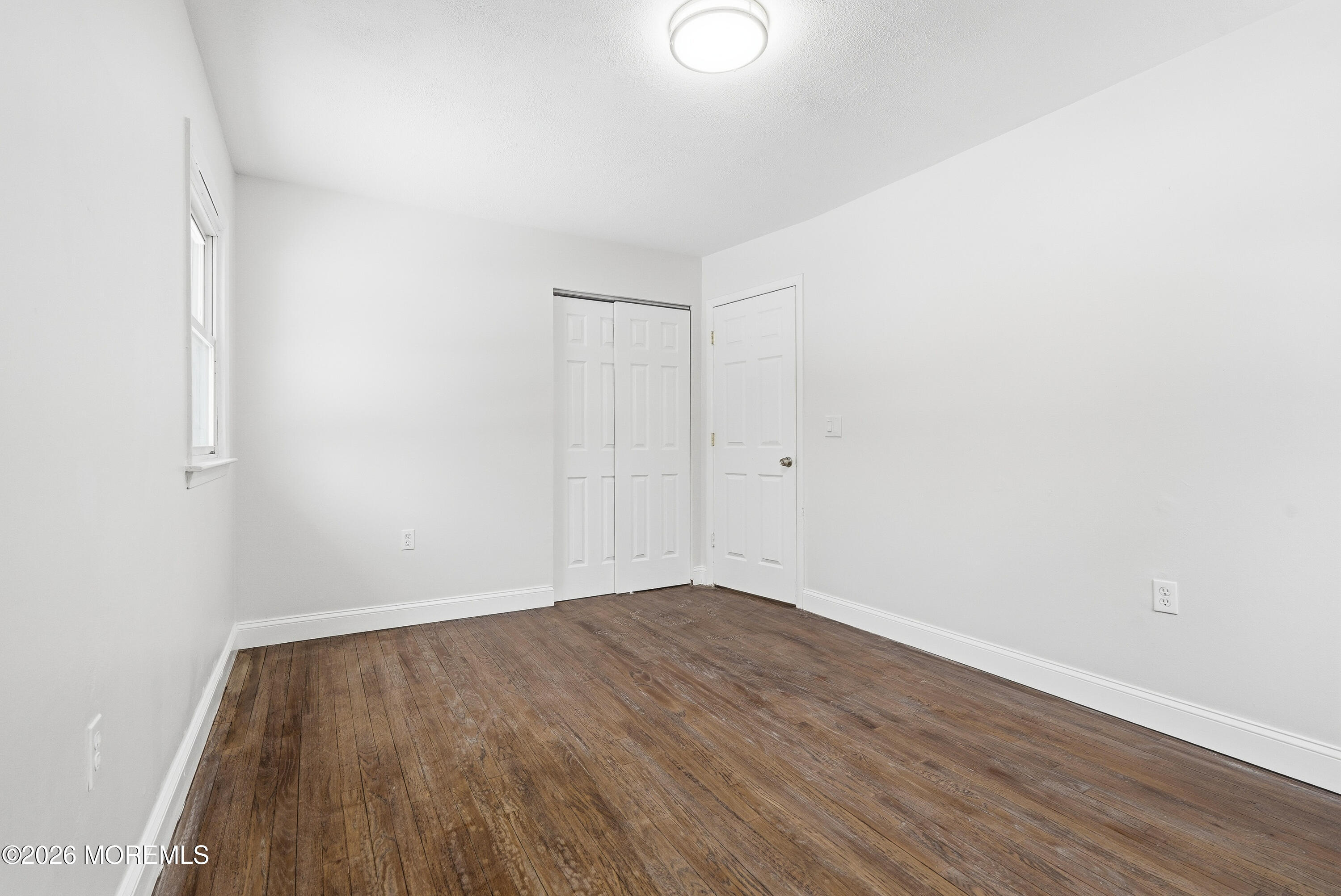 16 Crest Road Jackson, NJ 08527 - Photo 33 of 56 a view of an empty room with wooden floor