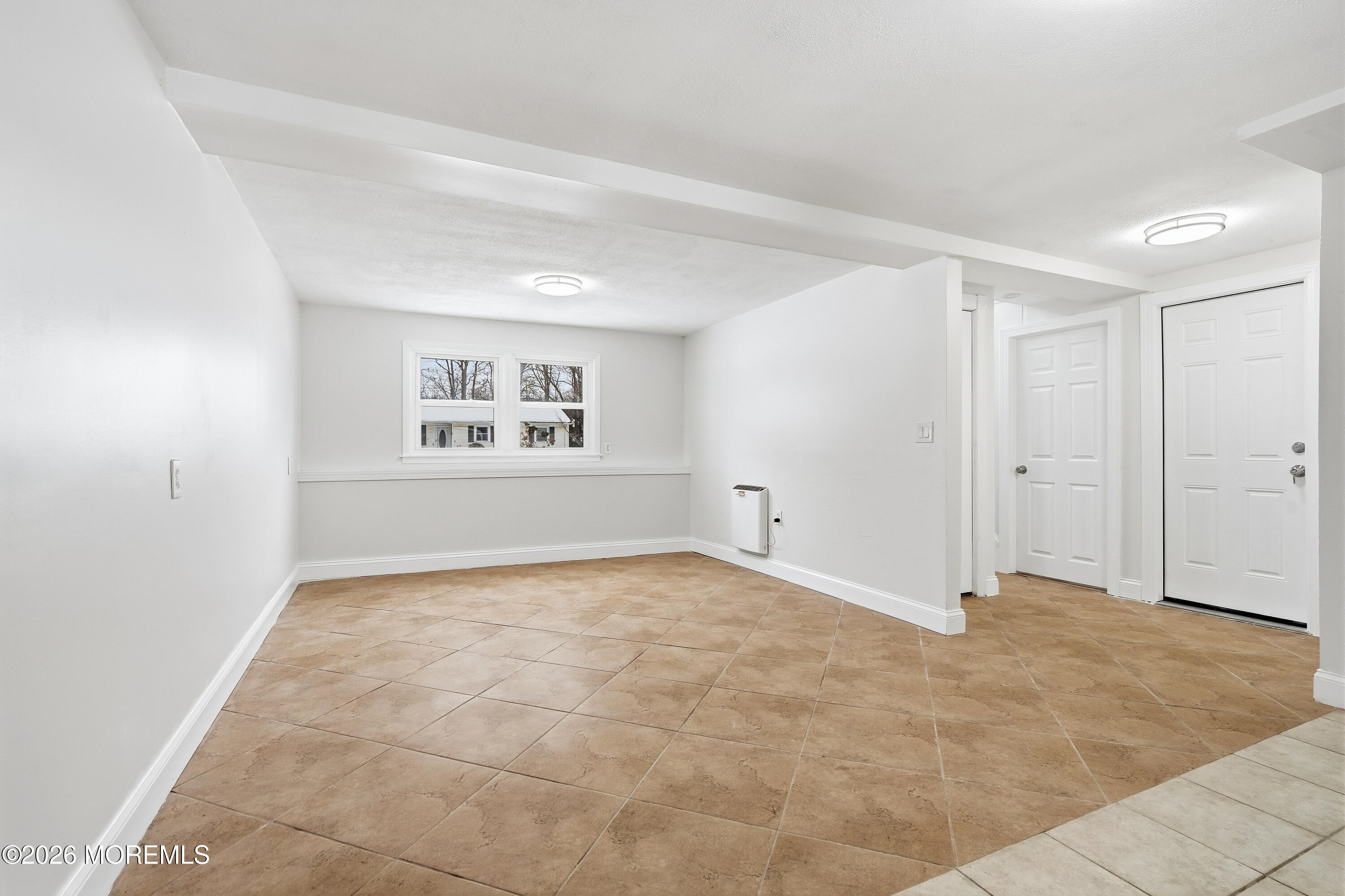 16 Crest Road Jackson, NJ 08527 - Photo 36 of 56 a view of an empty room with a window