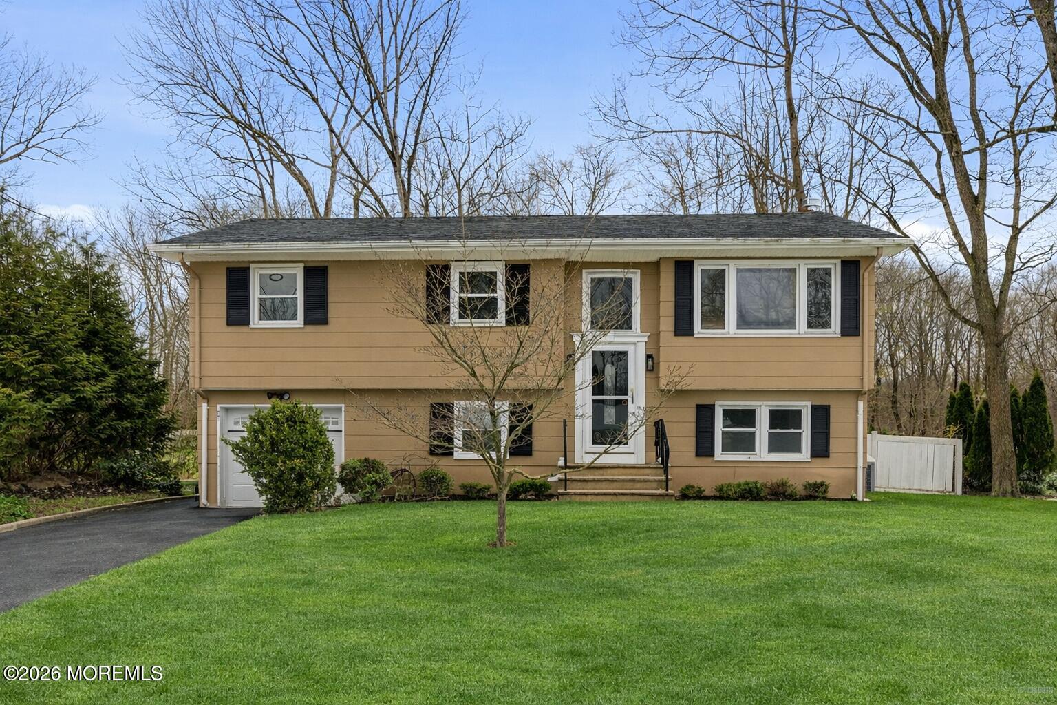 16 Crest Road Jackson, NJ 08527 - Photo 39 of 56 front view of a house with a yard