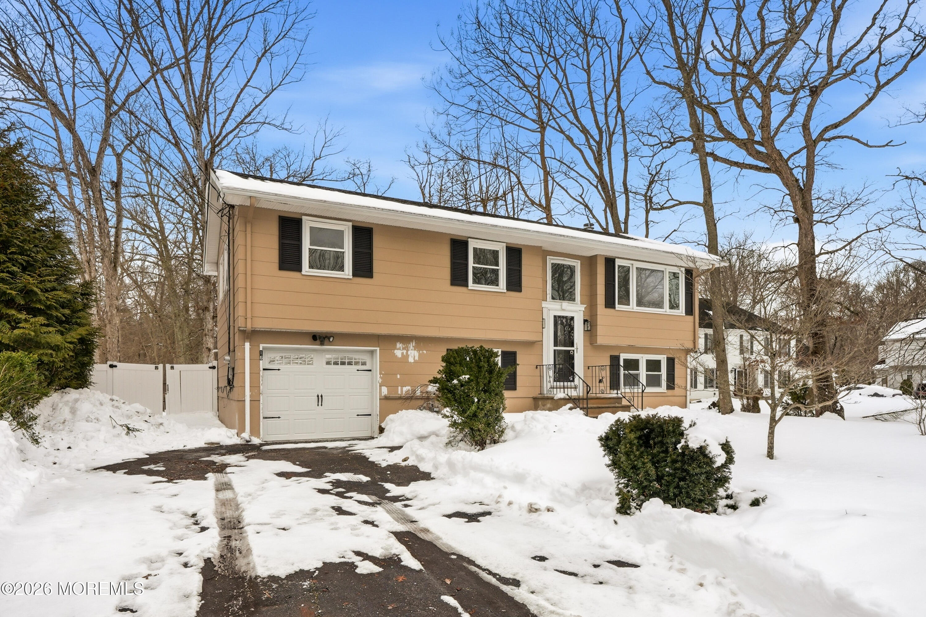 16 Crest Road Jackson, NJ 08527 - Photo 42 of 56 a front view of a house with a yard covered in snow