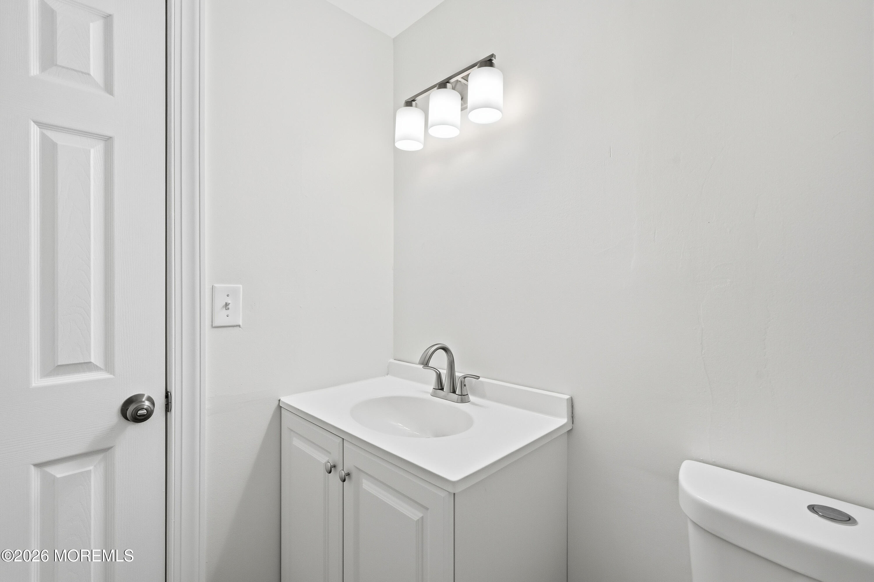 16 Crest Road Jackson, NJ 08527 - Photo 44 of 56 a bathroom with a sink a toilet and a mirror