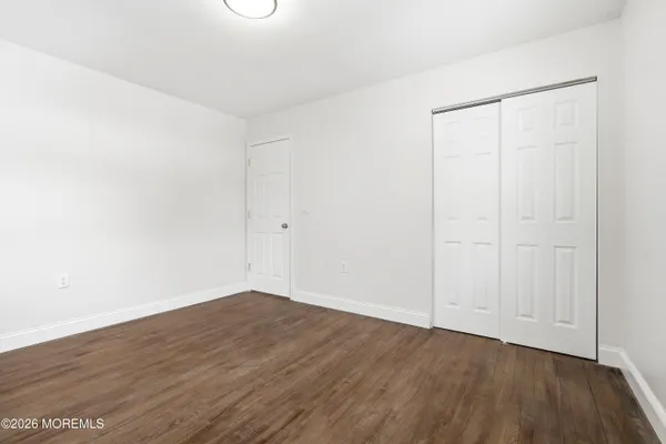 a bedroom with a bed and a table in it