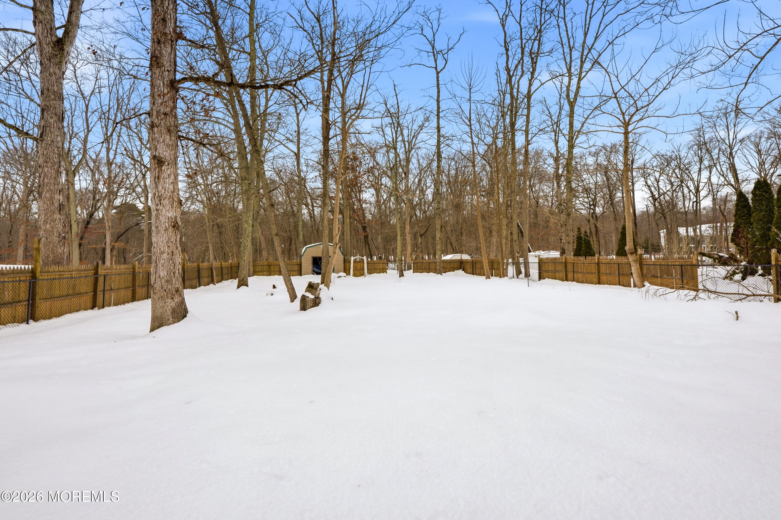 16 Crest Road Jackson, NJ 08527 - Photo 10 of 56 a street view covered with snow