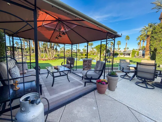 a view of chairs and tables in the patio