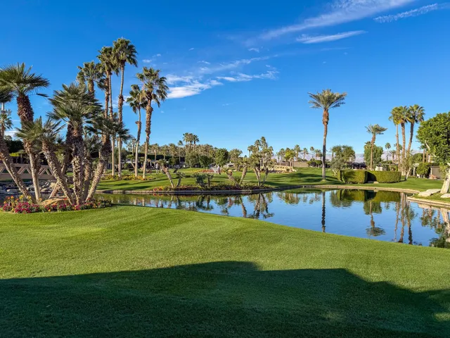 a view of a swimming pool with an outdoor space and seating area