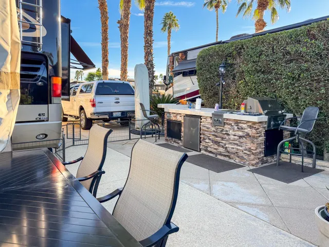 a view of swimming pool with a table and chairs