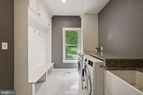 a bathroom with a toilet a sink and a mirror