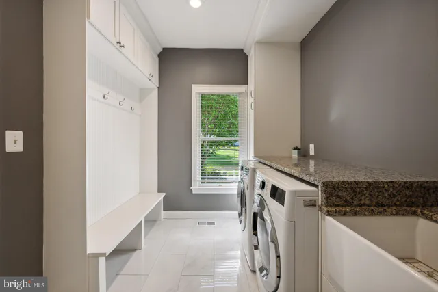 a bathroom with a toilet a sink and a mirror