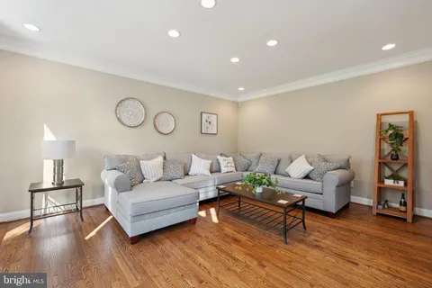 a spacious bedroom with a bed a fireplace and a large window