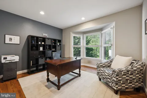 a spacious bedroom with a bed and a fireplace