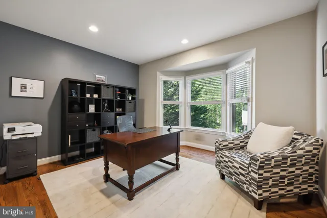 a spacious bedroom with a bed and a fireplace