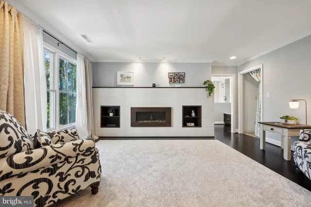 a bedroom with a bed and a ceiling fan