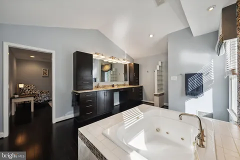 a bedroom with a balcony a bed and a couch