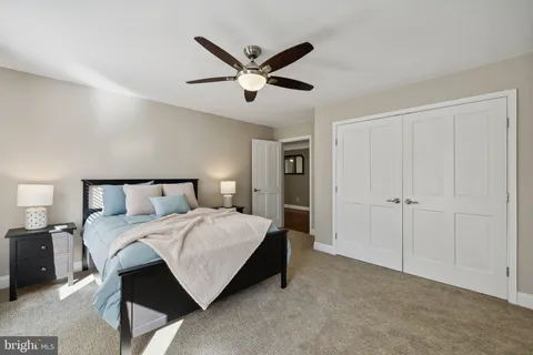 a room with wooden floor table tennis and stairs