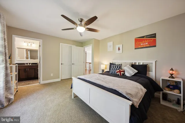 a large living room with stainless steel appliances granite countertop a couch and a view of kitchen
