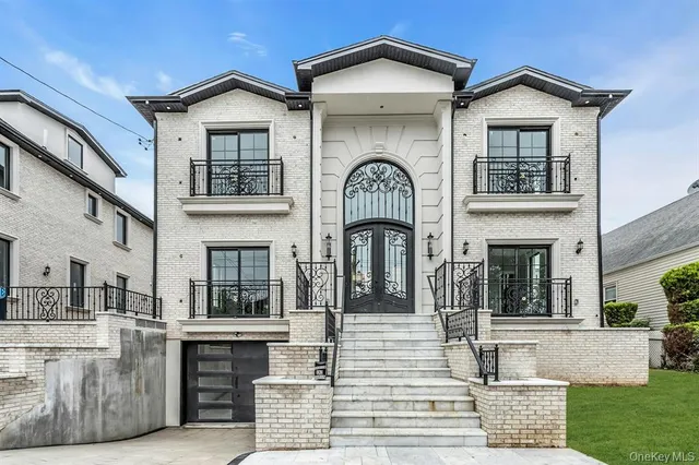 a view of a brick house with large windows