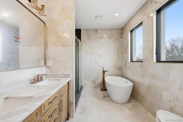 a bathroom with a toilet and shower