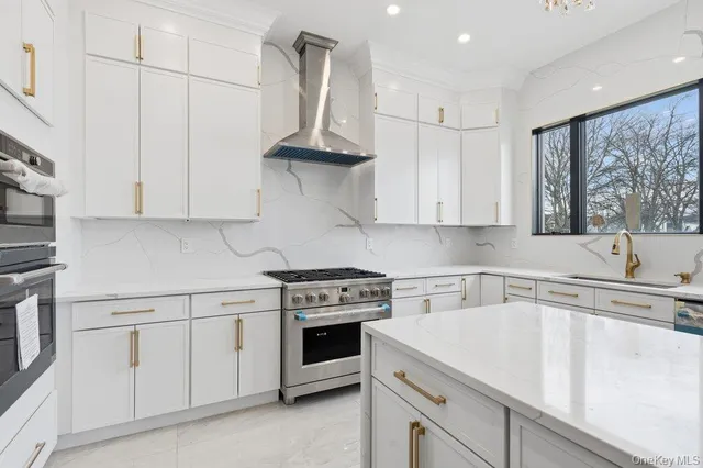 a kitchen with stainless steel appliances a stove a refrigerator and cabinets