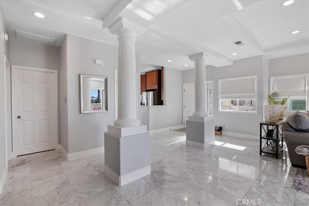 7 Centre Court Dana Point, CA 92629 - Photo 7 of 59 From dining room facing entrance and kitchen. Door is to the guest bedroom on the left.