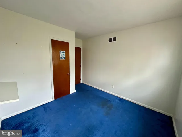 an empty room with a windows