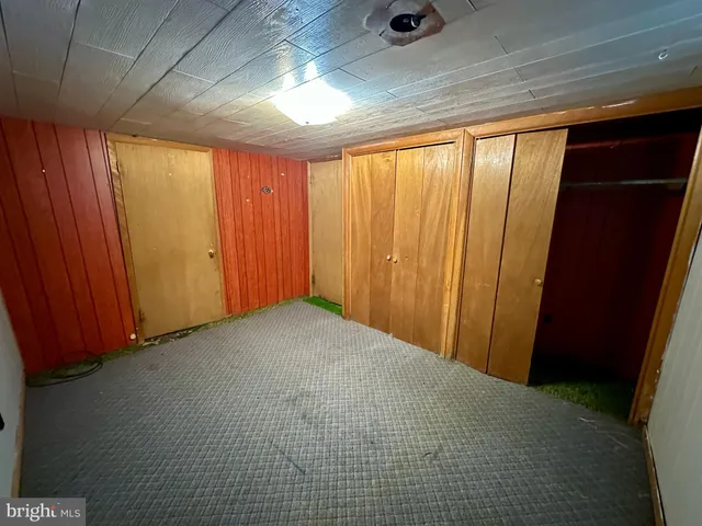 a view of a balcony with wooden floor and city view