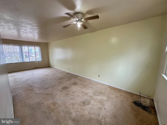 a kitchen with stainless steel appliances wooden cabinets a stove top oven a sink and dishwasher