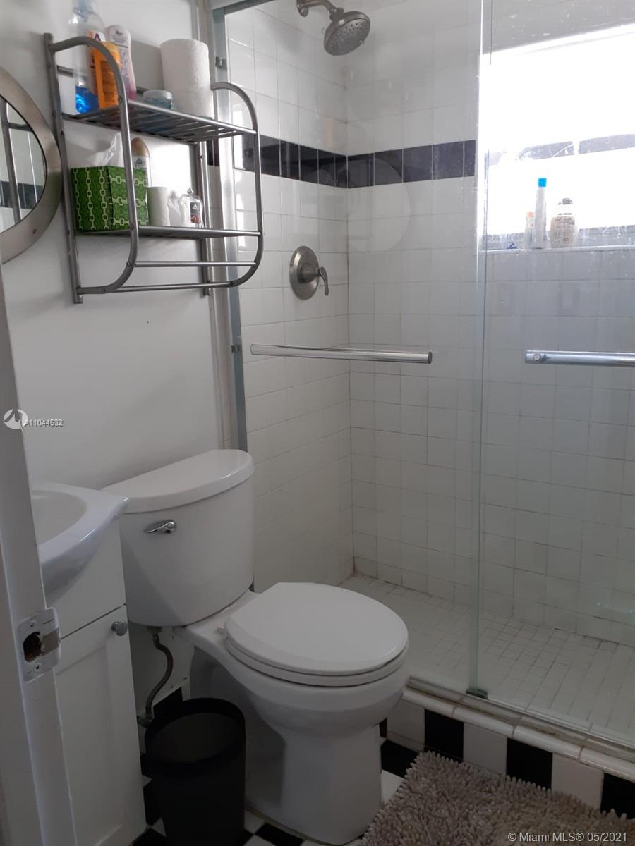 1404 Southwest 104th Court, Unit 89B Miami, FL 33174 - Photo 24 of 29 a bathroom with a toilet and a shower