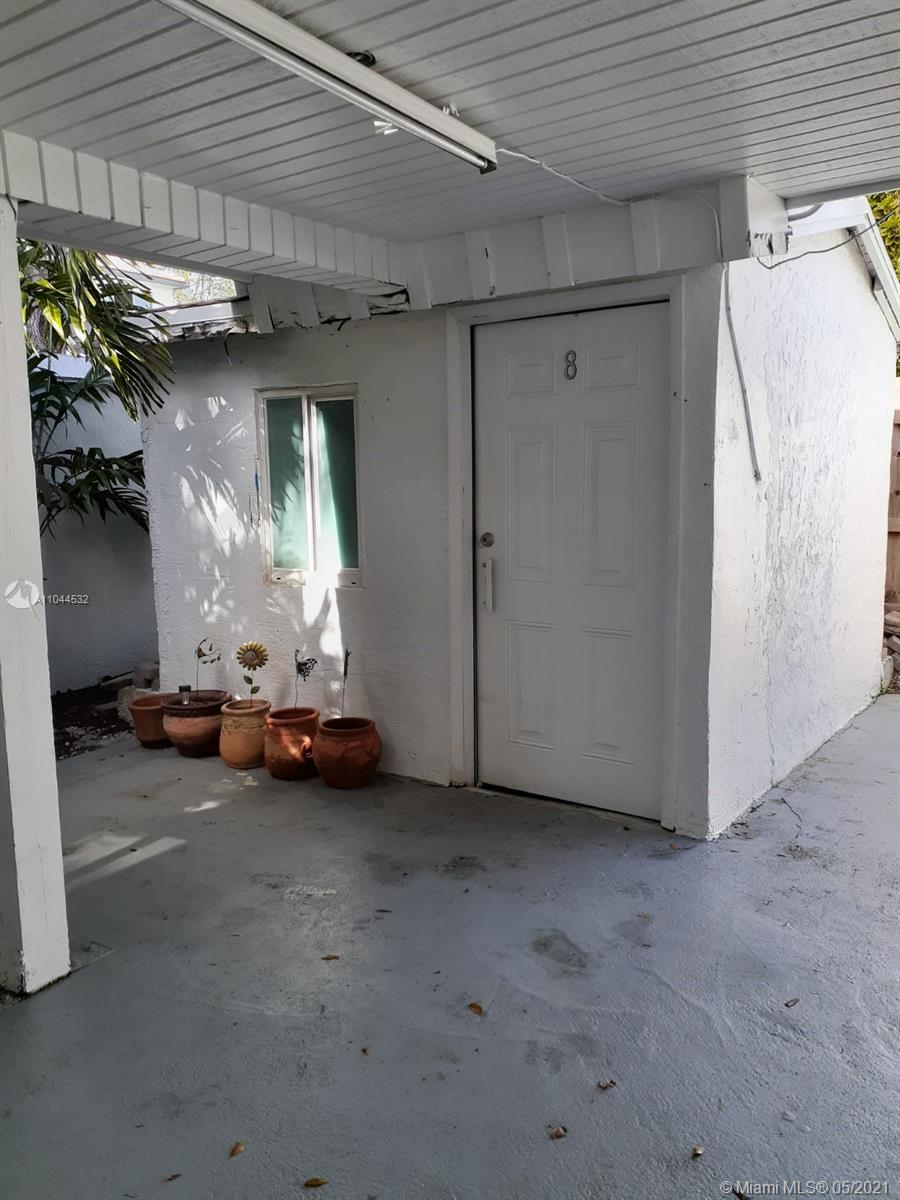 1404 Southwest 104th Court, Unit 89B Miami, FL 33174 - Photo 27 of 29 a view of a garage