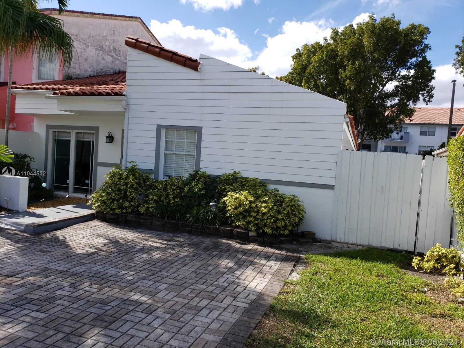 1404 Southwest 104th Court, Unit 89B Miami, FL 33174 - Photo 7 of 29 a front view of a house with a yard